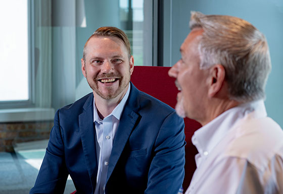 Two CSG employees meeting in the office